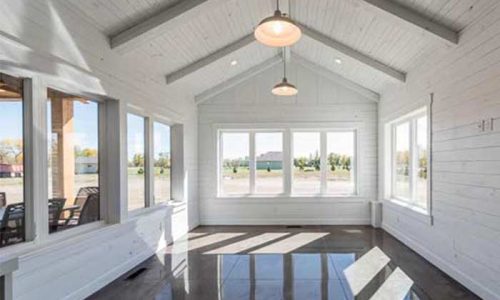 Large sunroom full of natural light with views of the open backyard